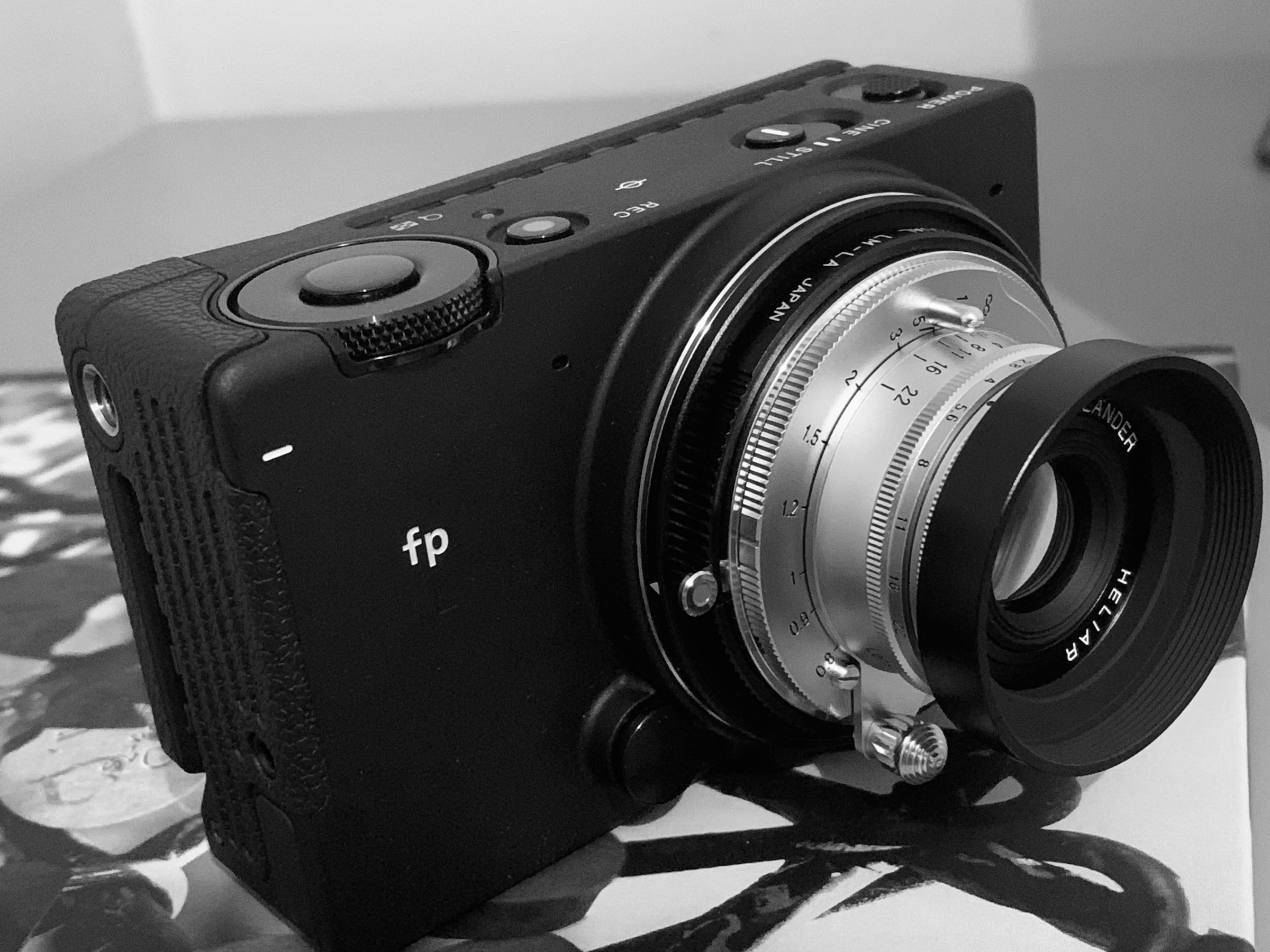 SIGMA FP L and Voigtländer Heliar 40mm portrayed together in black and white.
